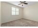 Bedroom with ceiling fan and window shutters at 16614 N 51St St, Scottsdale, AZ 85254