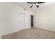 Bedroom with ceiling fan and double door closet at 16614 N 51St St, Scottsdale, AZ 85254