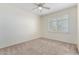 Bright bedroom with neutral carpeting and window shutters at 16614 N 51St St, Scottsdale, AZ 85254