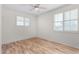 Bright bedroom with wood-look floors and large windows at 16614 N 51St St, Scottsdale, AZ 85254