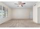 Well-lit bedroom featuring a ceiling fan and large windows at 16614 N 51St St, Scottsdale, AZ 85254