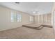 Spacious bonus room with built-in shelving and window shutters at 16614 N 51St St, Scottsdale, AZ 85254