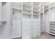 Large walk-in closet with ample shelving and drawers at 16614 N 51St St, Scottsdale, AZ 85254