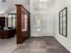 Bright entryway with tile floors, wood accents, and a view into an adjacent office at 16614 N 51St St, Scottsdale, AZ 85254