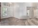 Bright entryway with tiled floors, a view of the laundry room, and stairs at 16614 N 51St St, Scottsdale, AZ 85254