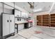 Organized garage with built-in shelving and work bench at 16614 N 51St St, Scottsdale, AZ 85254