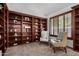 Cozy reading nook in home office with built-in bookshelves and comfy chairs at 16614 N 51St St, Scottsdale, AZ 85254