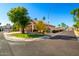 Home's exterior and surrounding neighborhood view from the street at 16614 N 51St St, Scottsdale, AZ 85254