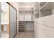 Large walk-in closet with shelves and drawers at 16614 N 51St St, Scottsdale, AZ 85254