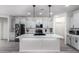 Modern kitchen featuring a large island and stainless steel appliances at 17215 W Molly Ln, Surprise, AZ 85387