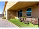 Relaxing patio area with seating and string lights at 17215 W Molly Ln, Surprise, AZ 85387