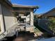 Outdoor kitchen and sitting area with artificial turf at 17256 W West Wind Dr, Surprise, AZ 85387