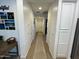 Bright hallway with wood floors and neutral walls at 17256 W West Wind Dr, Surprise, AZ 85387