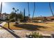 Landscaped community lawn with mature trees and walkways at 17404 N 99Th Ave # 205, Sun City, AZ 85373