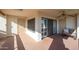 Private patio with seating and access to sliding doors at 17404 N 99Th Ave # 205, Sun City, AZ 85373