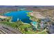 Stunning aerial view of a lake with surrounding community at 18370 W Goldenrod St, Goodyear, AZ 85338