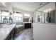 Spa-like bathroom with soaking tub, double vanity, and walk-in shower at 18370 W Goldenrod St, Goodyear, AZ 85338