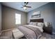 Spacious bedroom with cozy bedding and ample natural light at 18370 W Goldenrod St, Goodyear, AZ 85338