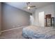 Bedroom with ceiling fan and gray carpet at 18370 W Goldenrod St, Goodyear, AZ 85338