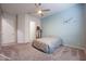 Bedroom with ceiling fan and light blue accent wall at 18370 W Goldenrod St, Goodyear, AZ 85338