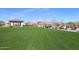 Expansive grassy area with a shaded pavilion and seating at 18370 W Goldenrod St, Goodyear, AZ 85338