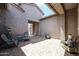 Private courtyard with seating and potted plants at 18370 W Goldenrod St, Goodyear, AZ 85338