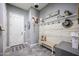 Inviting entryway with rustic bench and decorative wall at 18370 W Goldenrod St, Goodyear, AZ 85338