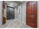 Bright entryway with a barn door and wood flooring at 18370 W Goldenrod St, Goodyear, AZ 85338