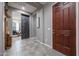 Bright entryway with a barn door and wood flooring at 18370 W Goldenrod St, Goodyear, AZ 85338