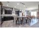 Modern kitchen with island, stainless steel appliances, and ample counter space at 18370 W Goldenrod St, Goodyear, AZ 85338