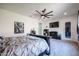 Main bedroom with king-size bed and large TV at 18370 W Goldenrod St, Goodyear, AZ 85338