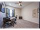 Home office features a desk and comfortable chair at 18370 W Goldenrod St, Goodyear, AZ 85338