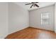 Bedroom with wood-looking floors and ceiling fan at 1866 E Dust Devil Dr, San Tan Valley, AZ 85143