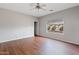 Bedroom with large window and ceiling fan at 1866 E Dust Devil Dr, San Tan Valley, AZ 85143