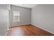 Bright bedroom with wood-look floors and window blinds at 1866 E Dust Devil Dr, San Tan Valley, AZ 85143