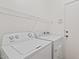 Laundry room with washer, dryer, and overhead shelving at 1866 E Dust Devil Dr, San Tan Valley, AZ 85143