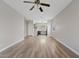 Spacious living room featuring wood-look flooring and a ceiling fan at 1866 E Dust Devil Dr, San Tan Valley, AZ 85143