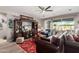 Living room with fireplace, comfortable seating and built-in entertainment center at 18904 W Mercer Ln, Surprise, AZ 85388