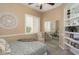 Charming bedroom with built-in shelving and mirrored closet at 1942 W Peninsula Cir, Chandler, AZ 85248