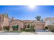 House exterior showcasing Spanish-style architecture and manicured lawn at 1942 W Peninsula Cir, Chandler, AZ 85248