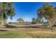 Scenic view of a lush green golf course with mountains in the background at 1942 W Peninsula Cir, Chandler, AZ 85248