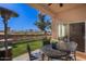 Relaxing patio area with seating, a heater, and a view of the yard at 1942 W Peninsula Cir, Chandler, AZ 85248