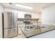 Modern kitchen with stainless steel appliances and granite countertops at 200 E Southern Ave # 175, Tempe, AZ 85282