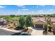 Single-story home with solar panels, a two-car garage, and desert landscaping at 20515 N 264Th Ave, Buckeye, AZ 85396