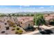 Single-story home with tile roof and desert landscaping, mountain views in background at 20515 N 264Th Ave, Buckeye, AZ 85396