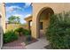 Landscaped courtyard entry with archway and mature plants at 20515 N 264Th Ave, Buckeye, AZ 85396