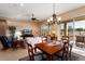 Casual dining area with table and chairs, near sliding doors to patio at 20515 N 264Th Ave, Buckeye, AZ 85396