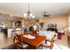 Bright dining area with wood table and chairs, adjacent to kitchen at 20515 N 264Th Ave, Buckeye, AZ 85396