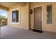 Front entry with a brown door and sidelights, and tiled flooring at 20515 N 264Th Ave, Buckeye, AZ 85396