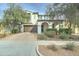 Inviting two-story home featuring a well-manicured front yard, attached two car garage, and covered front entry at 20552 W Carlton Mnr, Buckeye, AZ 85396